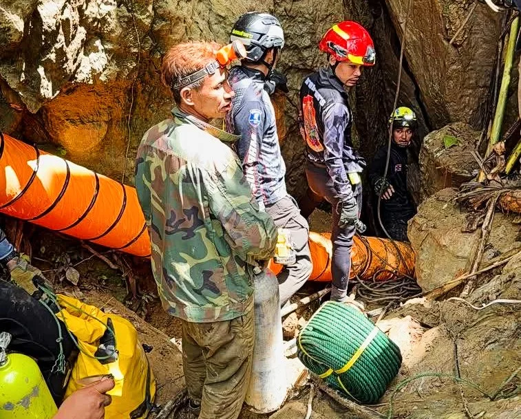 Rescuers entering the cave