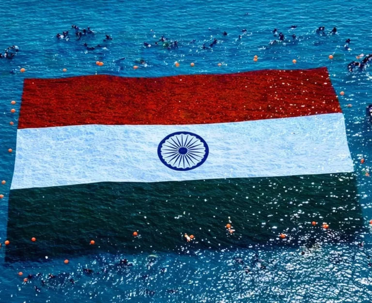 The giant national flag is unfurled by a team of some 200 scuba divers