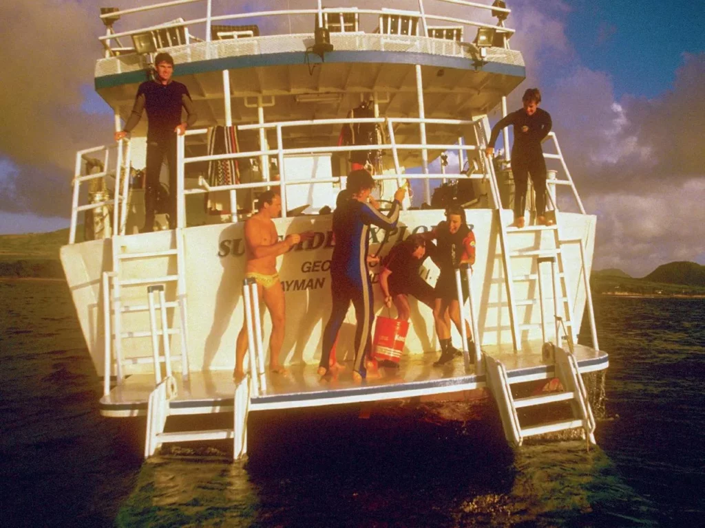 Q&A with Liveaboard Pioneer Clay McCardell 4 Divers enjoying the social atmosphere on the sun deck of an Explorer Ventures boat.
