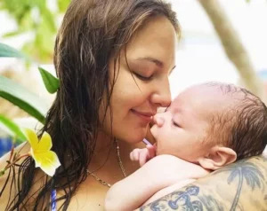 Diver Jocelyn Brown with her son