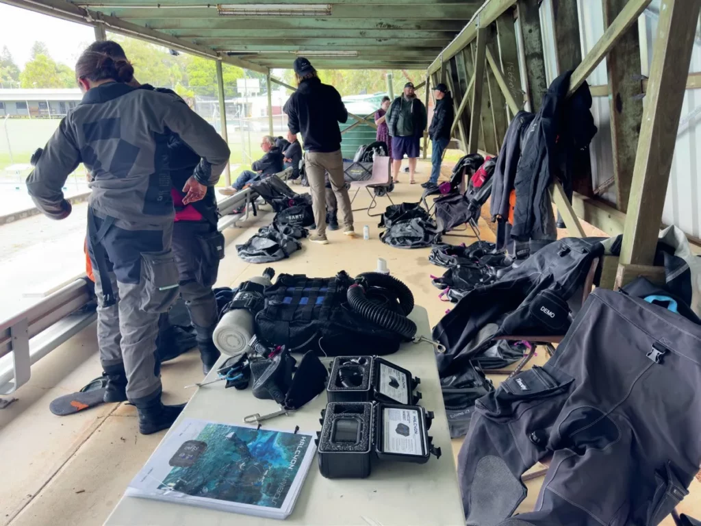 Divers kitting up to try rebreathers in the pool sessions