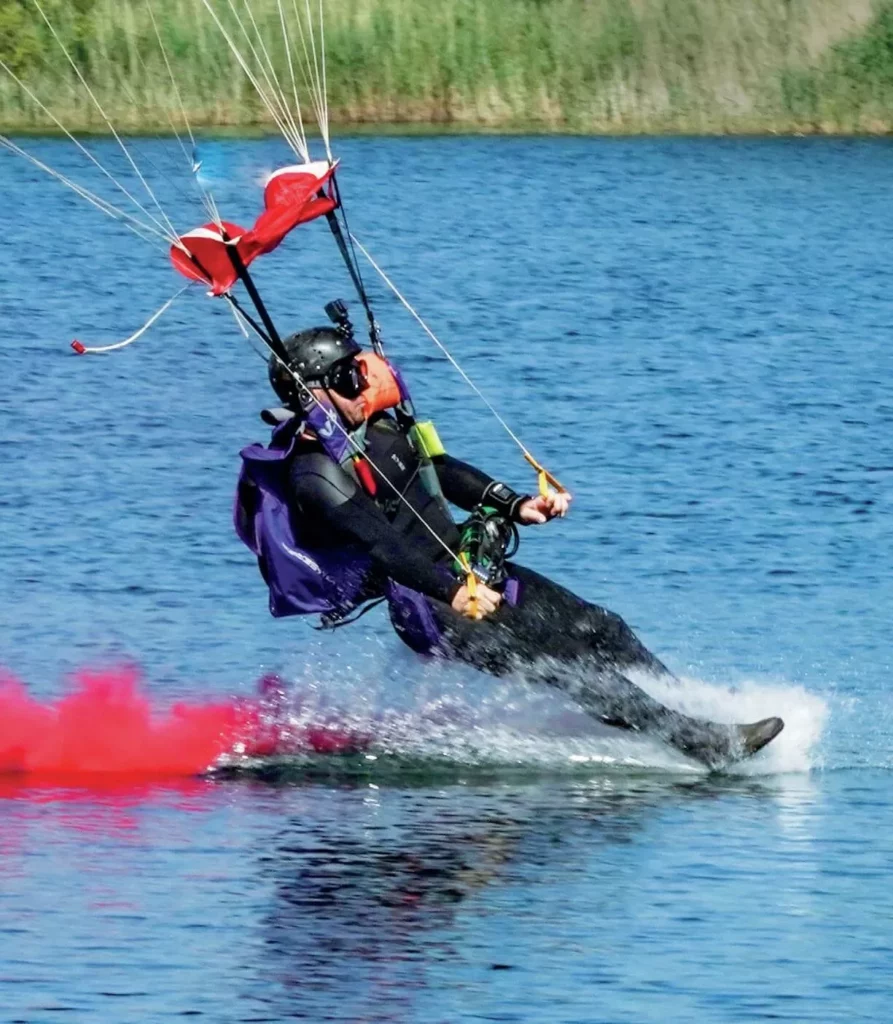 Andy Torbet landing a parachute in Spring Lakes for skydive to scuba stunt.