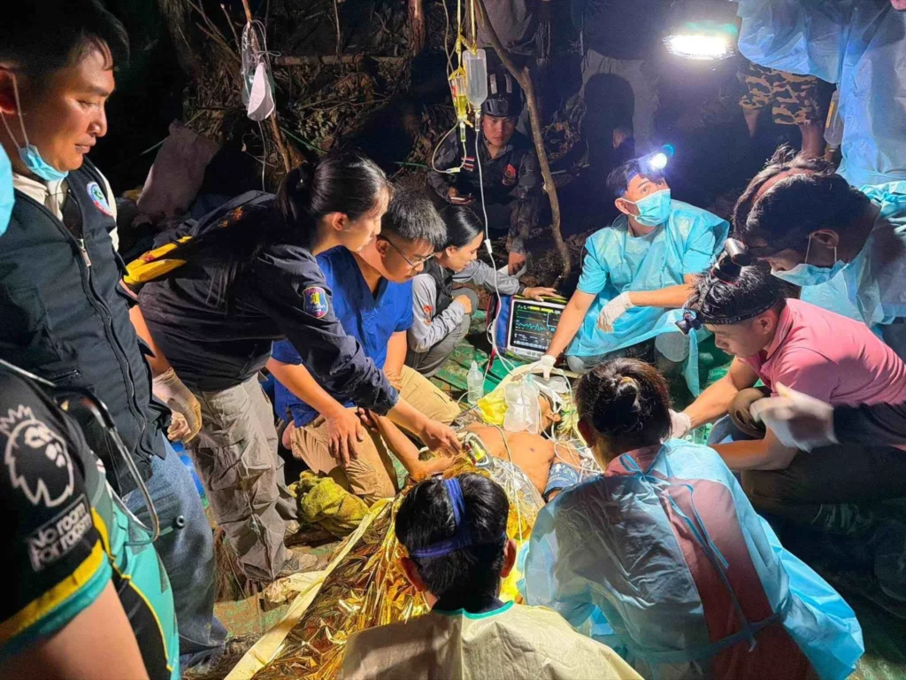 The medical team take over care of extracted men