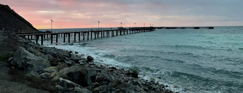Panoramic view of the massive 488-metre Rapid Bay jetty stretching out into the ocean along the Fleurieu Peninsula coast.