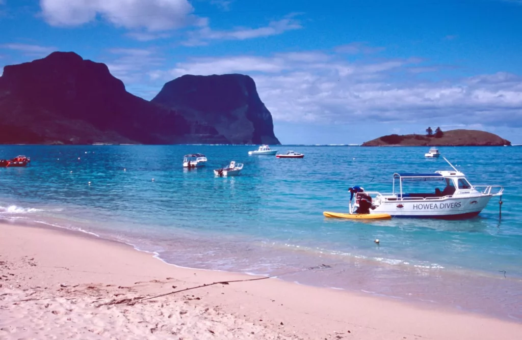 Main beach of Lord Howe with dive boat at mooring