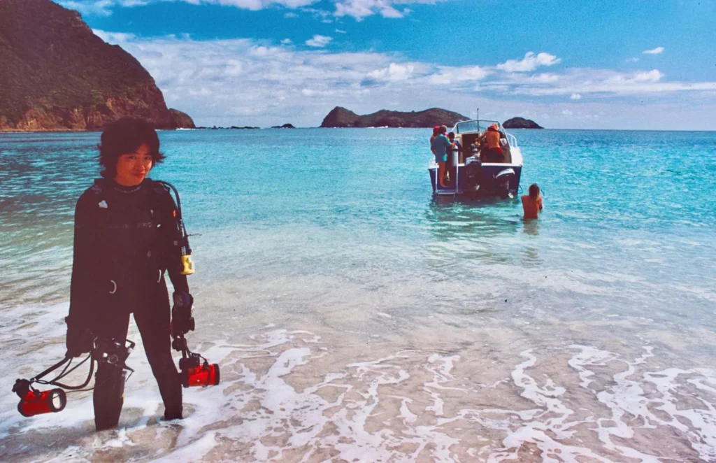 Disembarking at Ned’s Beach after a dive