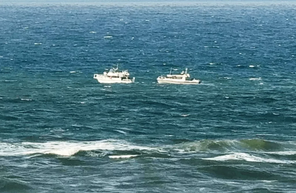 A Marine Rescue NSW boat reaches the scene (Marine Rescue Point Danger)