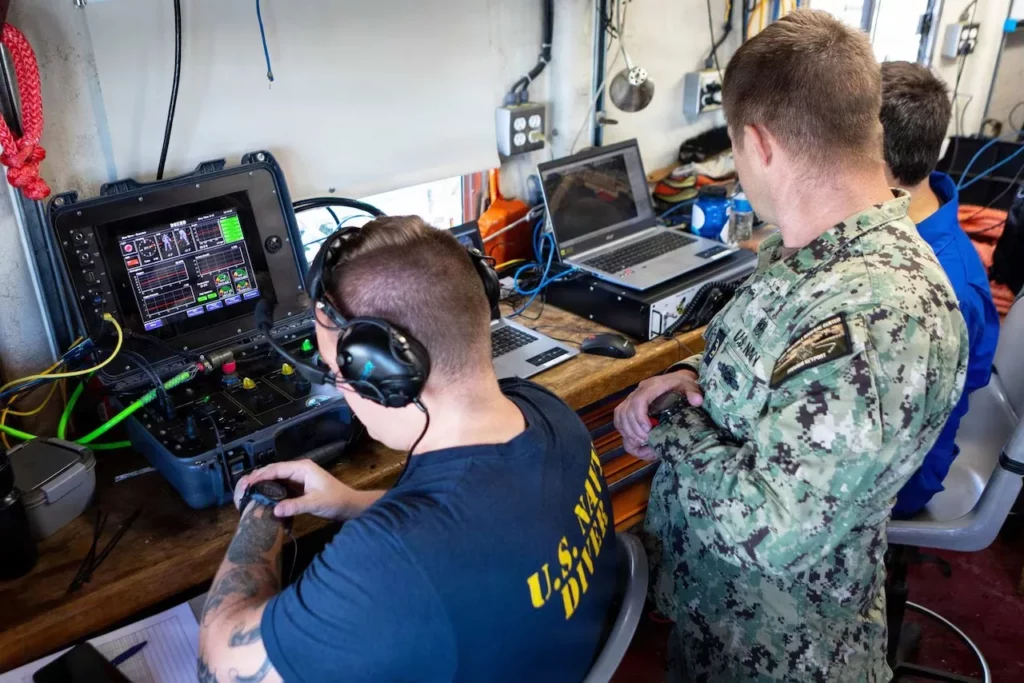 DSEND no-deco divers evolve from pool to seabed 2 Conducting pre-dive checks as Casteñeda prepares to test the suit (US Navy)