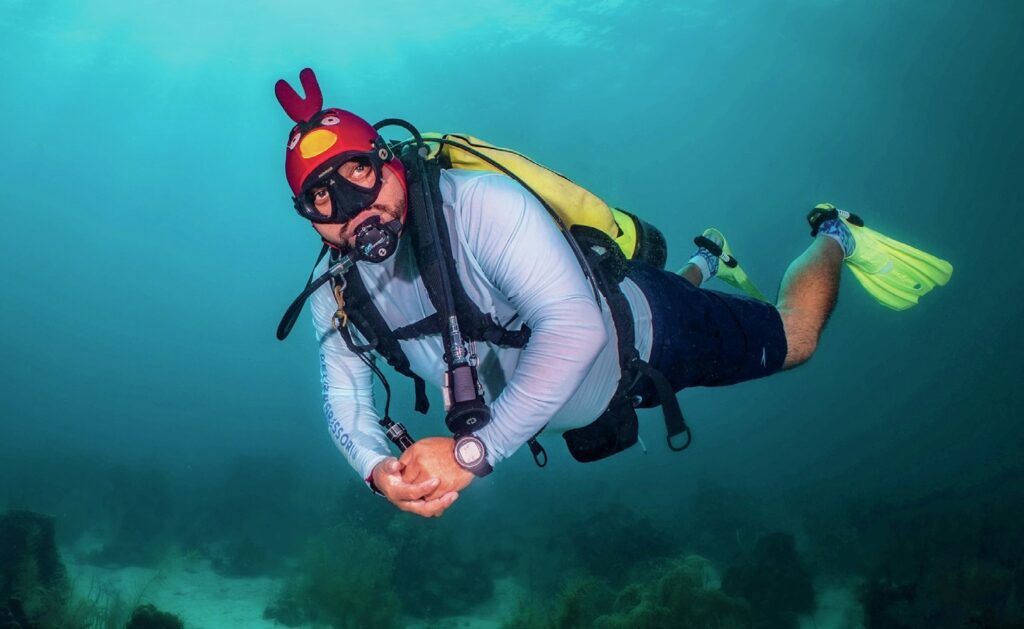 Diving in the Eye of the Storm: Byron Conroy's Belize Journey 1 Diver dressed as an angry birds character while diving