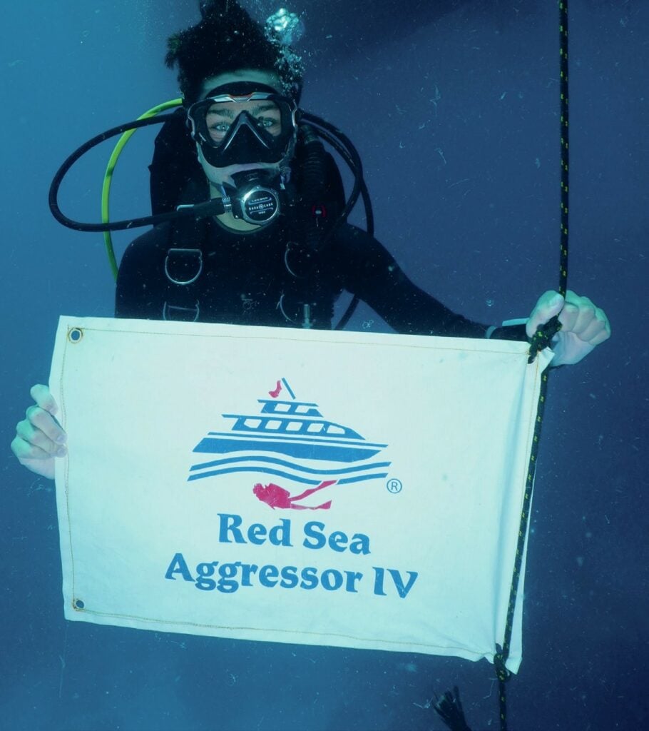 Luke with the Red Sea Aggressor IV dive flag