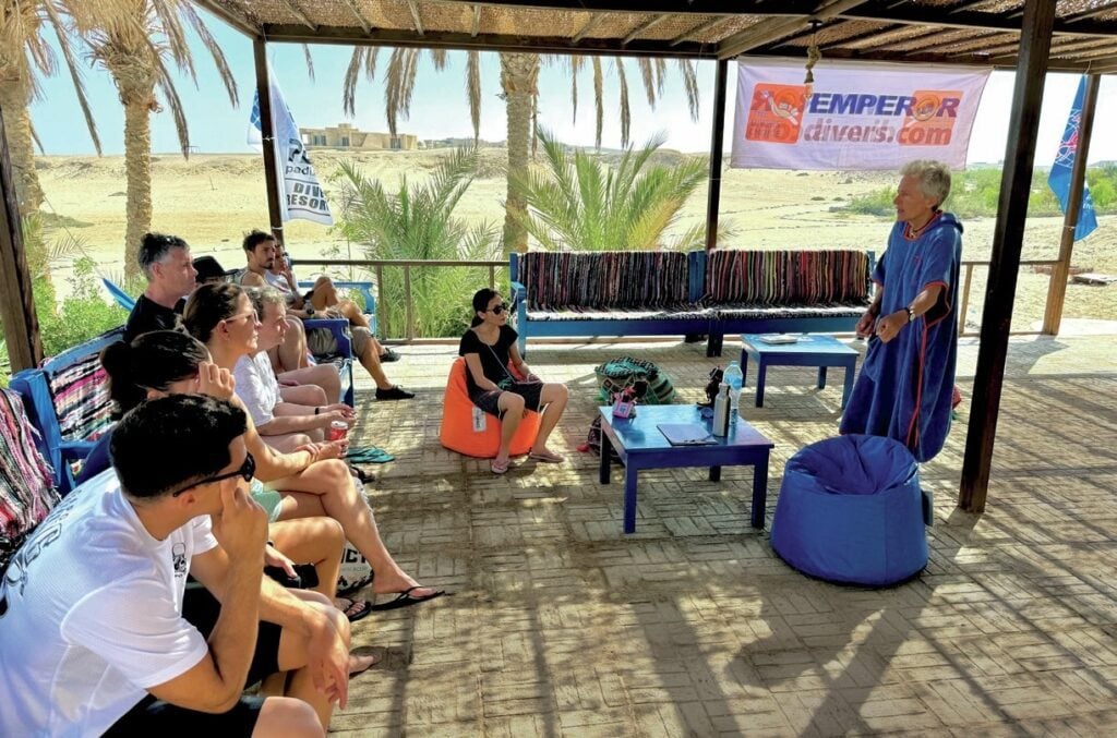 Dive guide Sonia Goggel giving a predive briefing at Wadi Sabarah Red Sea dive resort, Egypt
