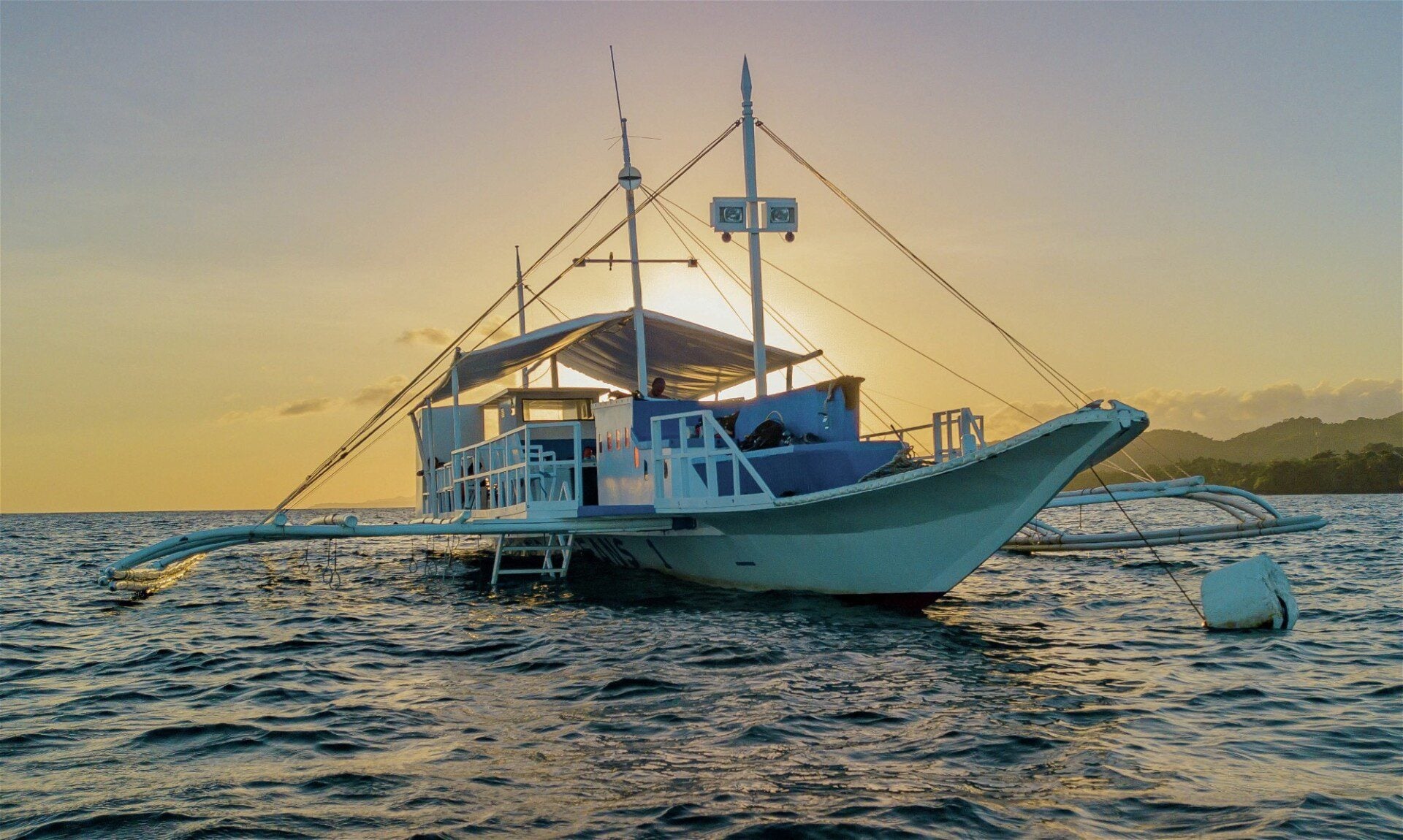 Dive boat at sunset