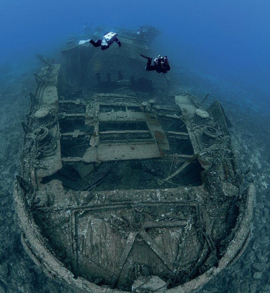 Scuba Diver Q & A: Kurt Storms 7 Divers exploring a massive shipwreck photographed by Kurt Storms