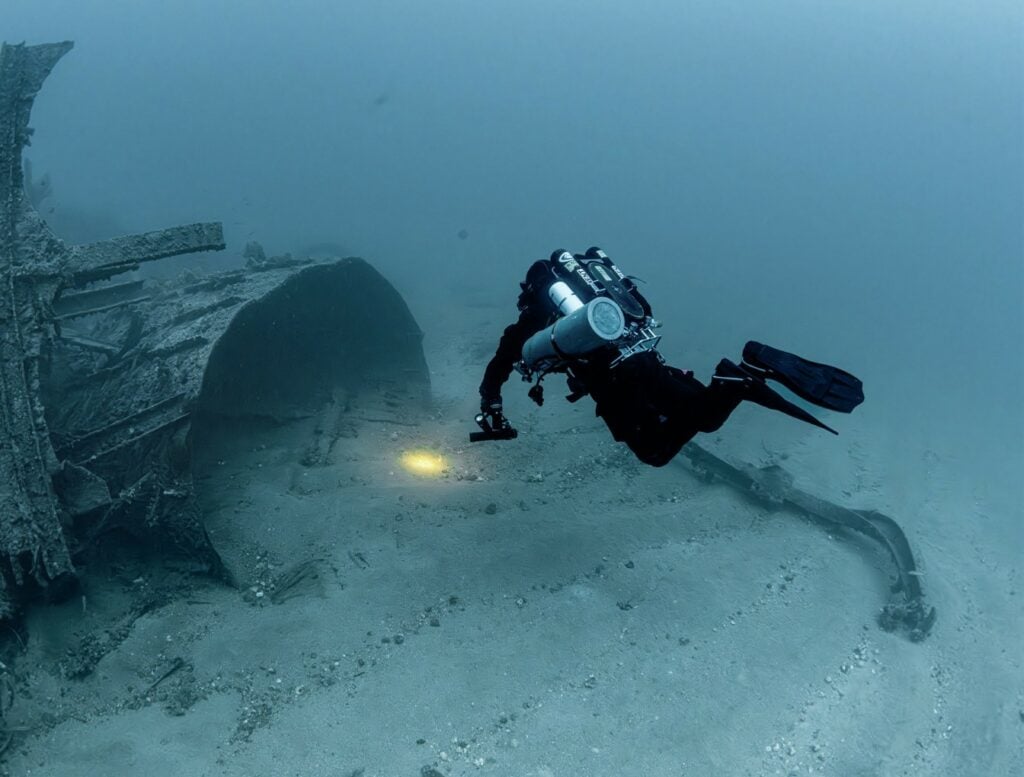 Diver exploring the HMS Southwold wreck, a World War Two destroyer attacked by Italian warships and the Luftwaffe off Malta